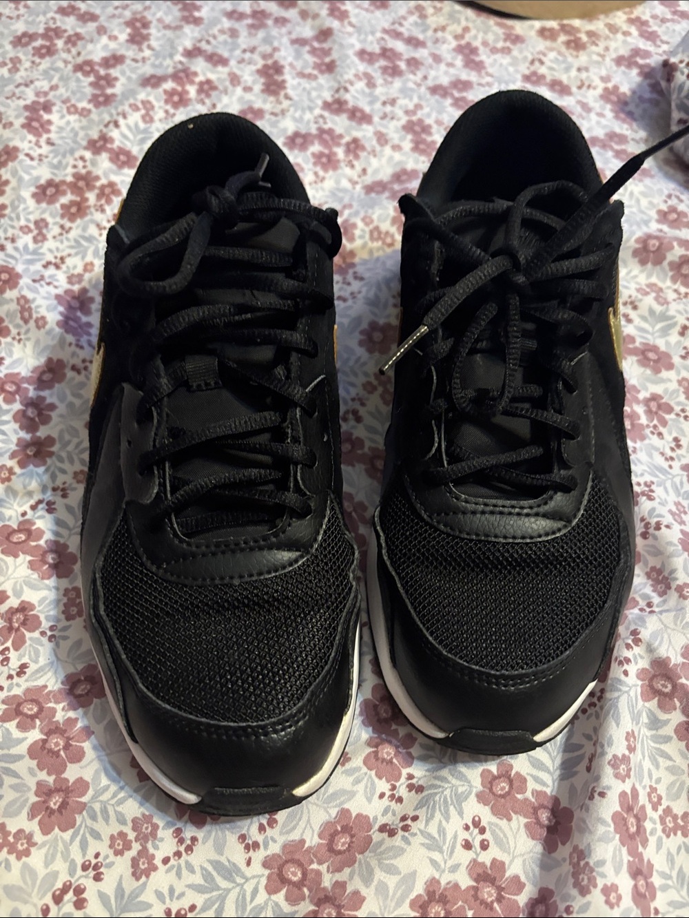 Nike Women's Black Sneakers with Subtle Gold Accent